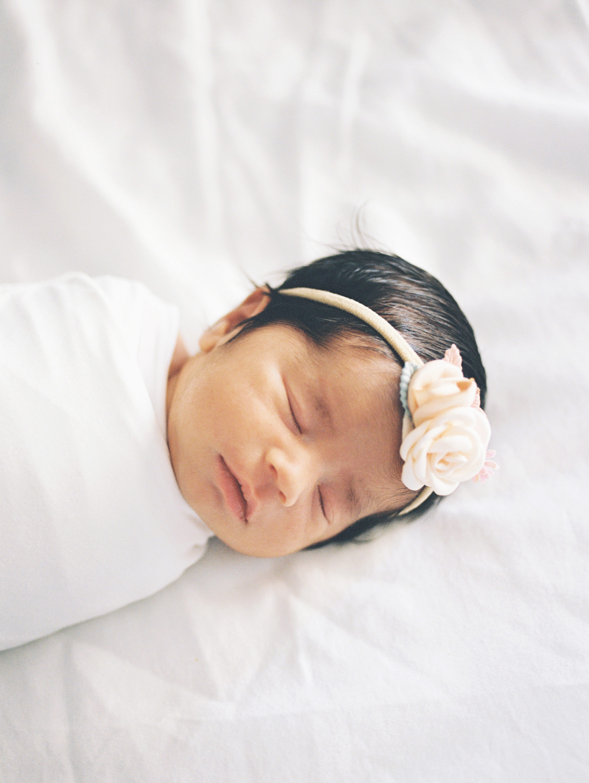 yuma-newborn-photography-sleeping-baby-girl-bed-portrait